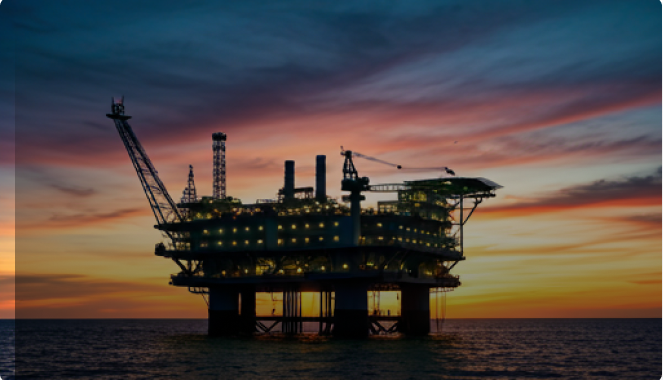 Offshore oil platform at sunset